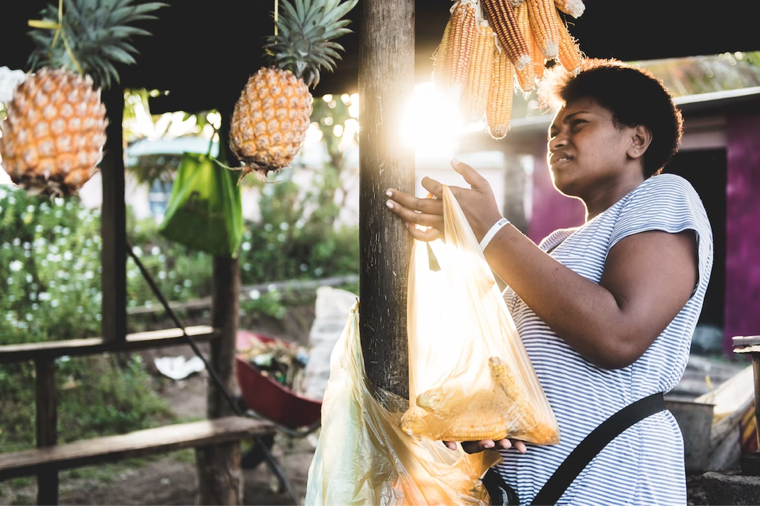Fiji Image-Woman Holding Pineapple